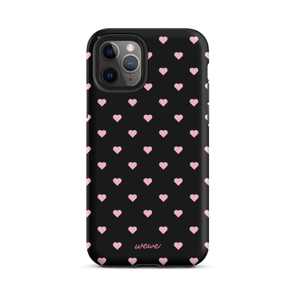Black iPhone case with evenly spaced soft-pink mini hearts
