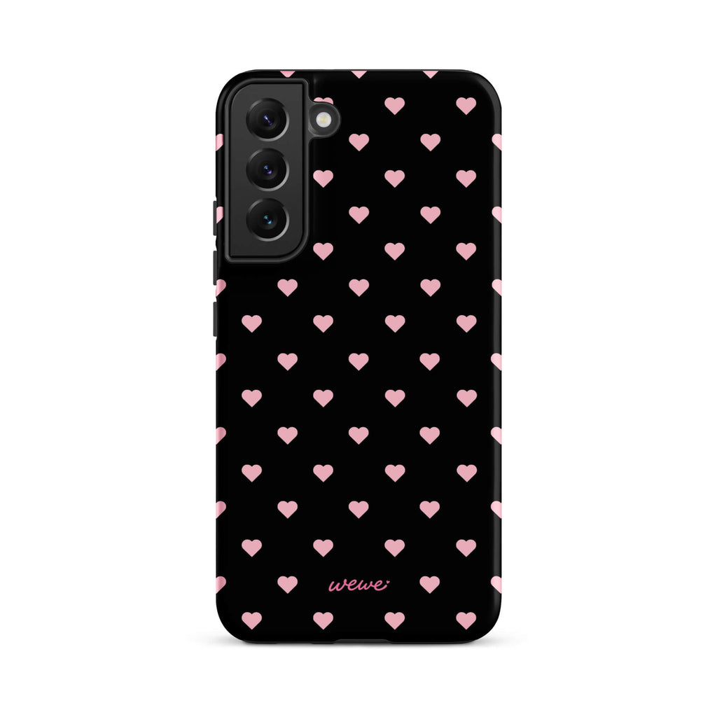 Black iPhone case with evenly spaced soft-pink mini hearts