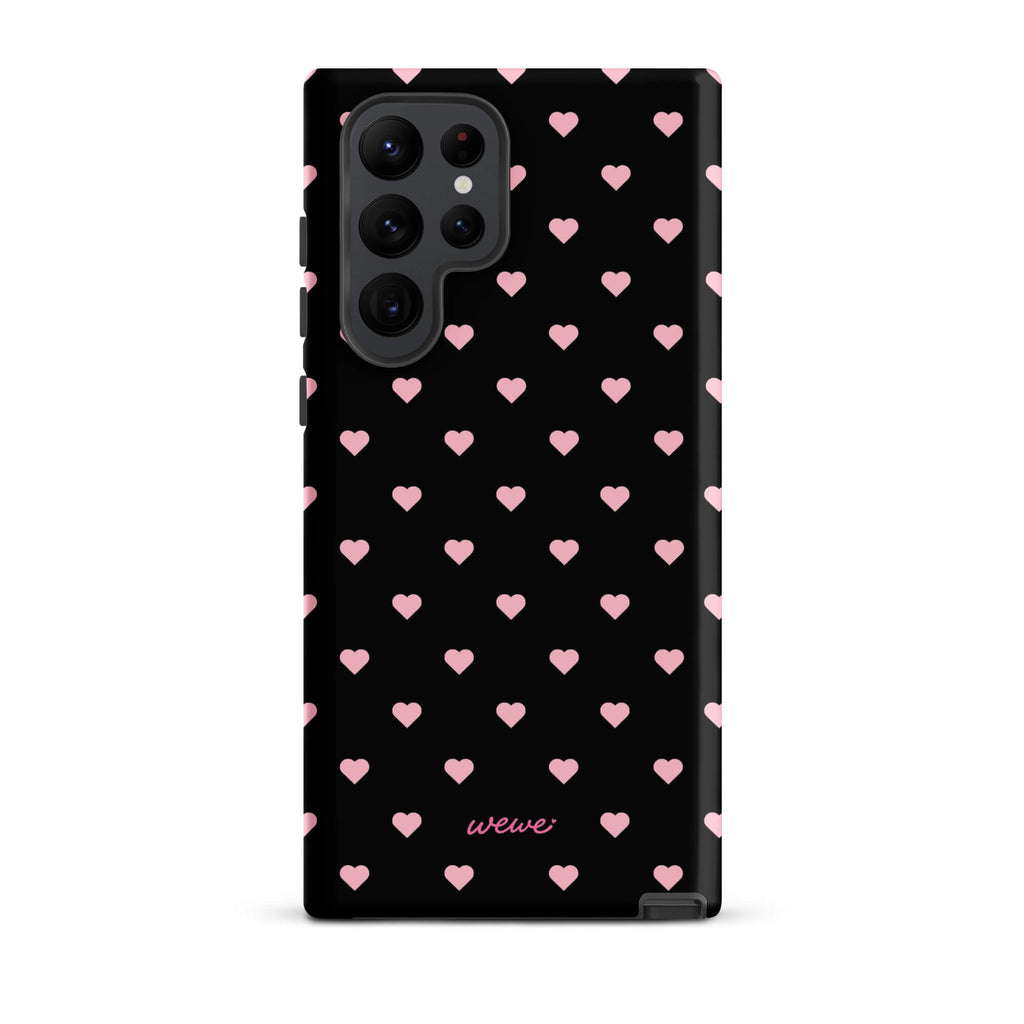Black iPhone case with evenly spaced soft-pink mini hearts
