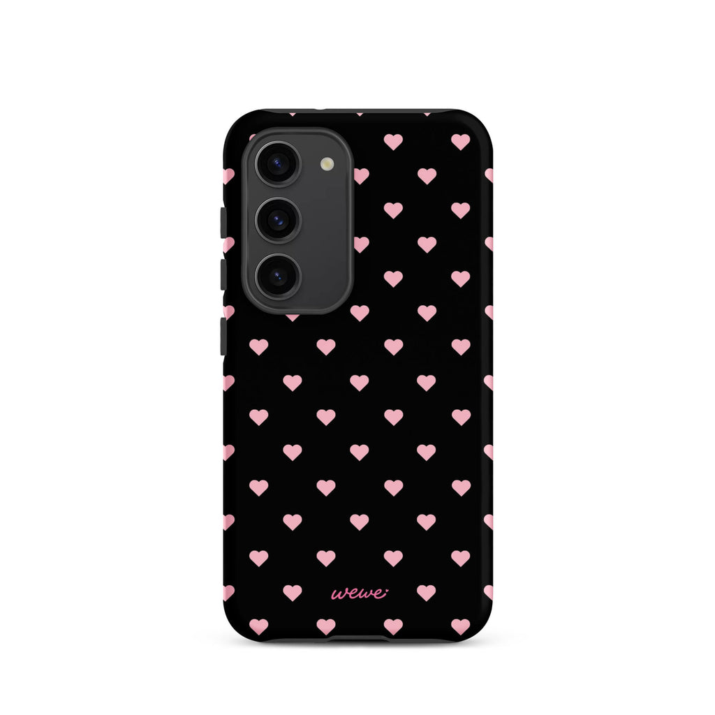 Black iPhone case with evenly spaced soft-pink mini hearts