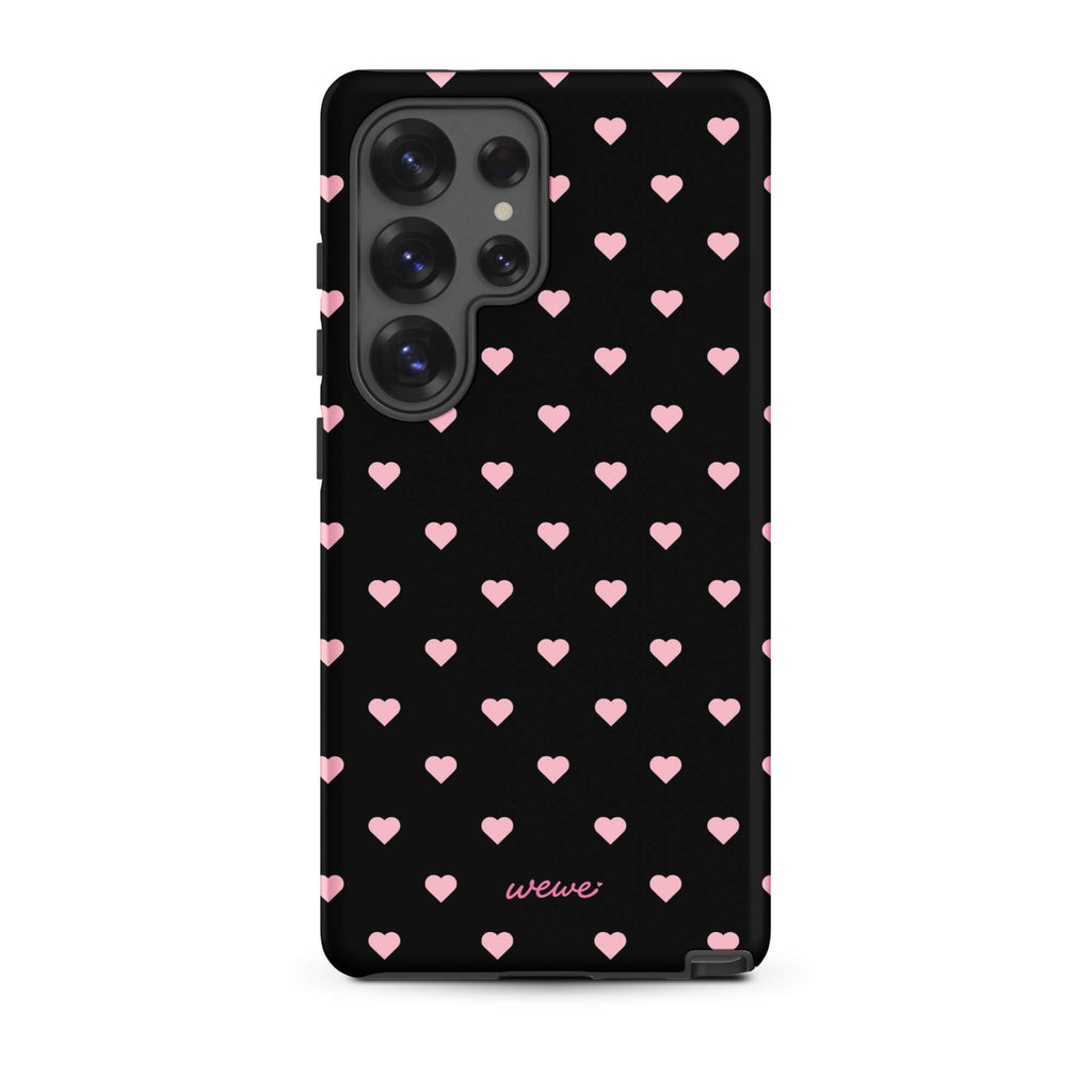 Black iPhone case with evenly spaced soft-pink mini hearts