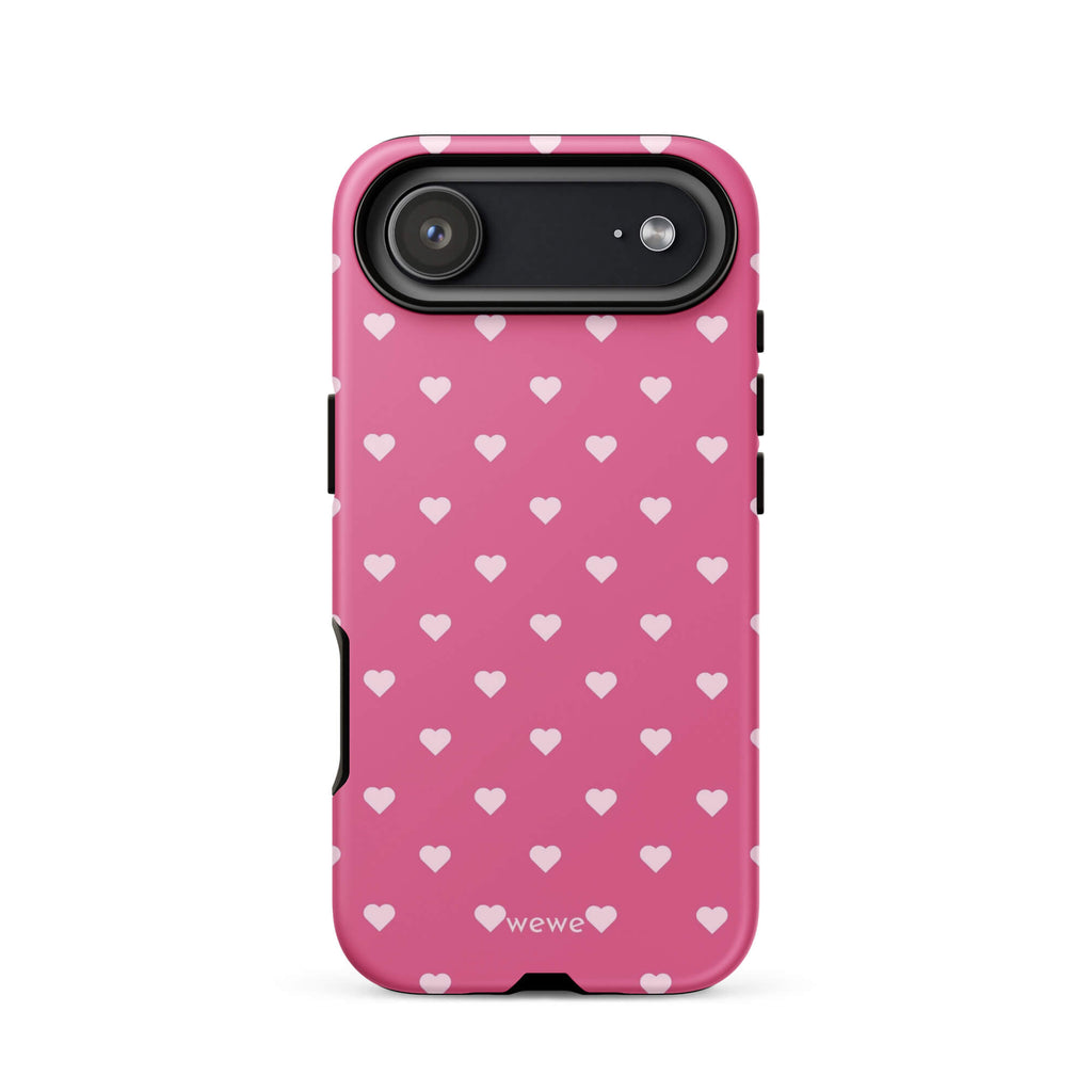 Bubblegum-pink iPhone case with evenly spaced pale blush-pink mini hearts