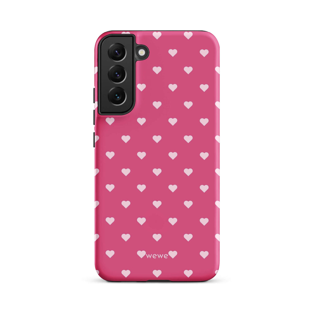 Bubblegum-pink iPhone case with evenly spaced pale blush-pink mini hearts