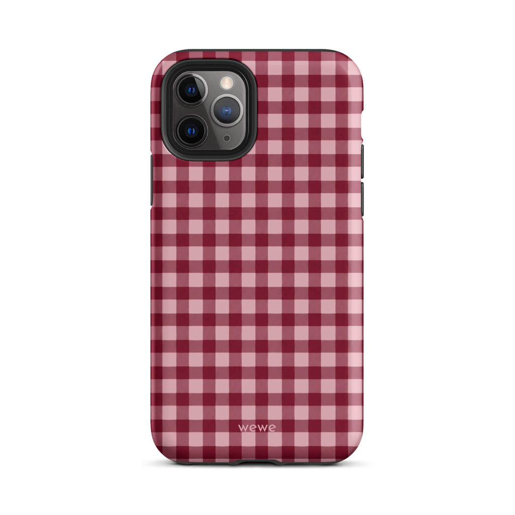 Deep burgundy and blush-pink iPhone case with an evenly repeated gingham check pattern