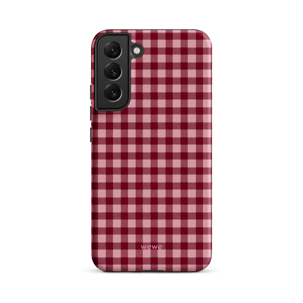 Deep burgundy and blush-pink iPhone case with an evenly repeated gingham check pattern