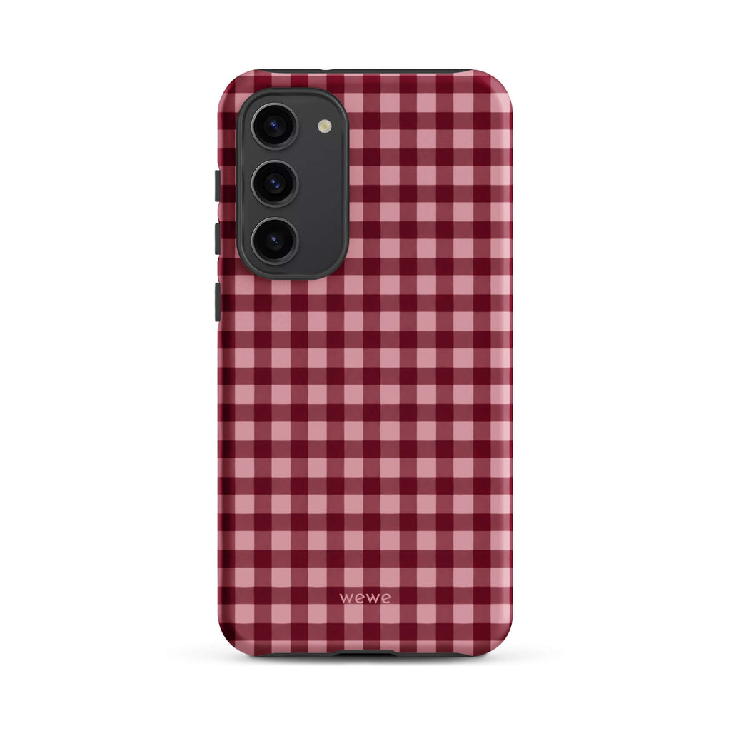 Deep burgundy and blush-pink iPhone case with an evenly repeated gingham check pattern