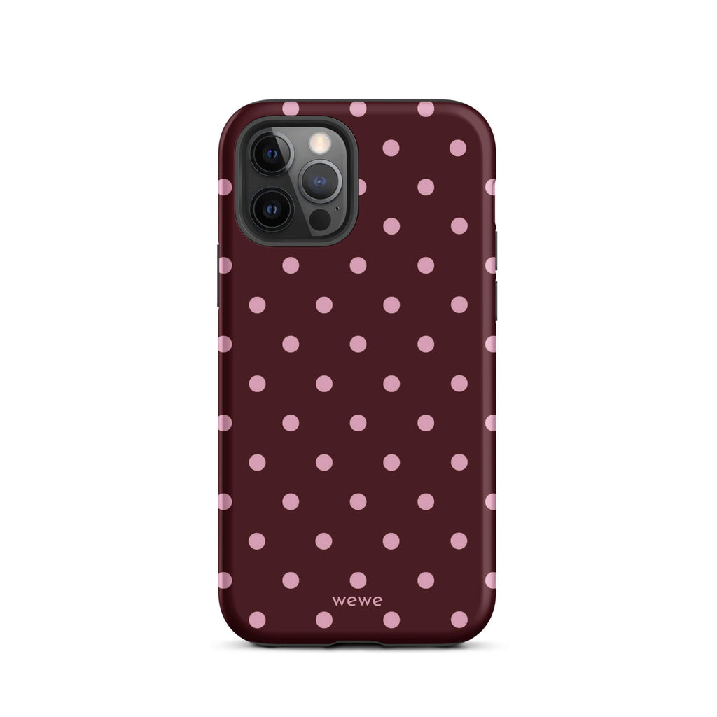 Deep burgundy iPhone case with evenly spaced soft-pink polka dots