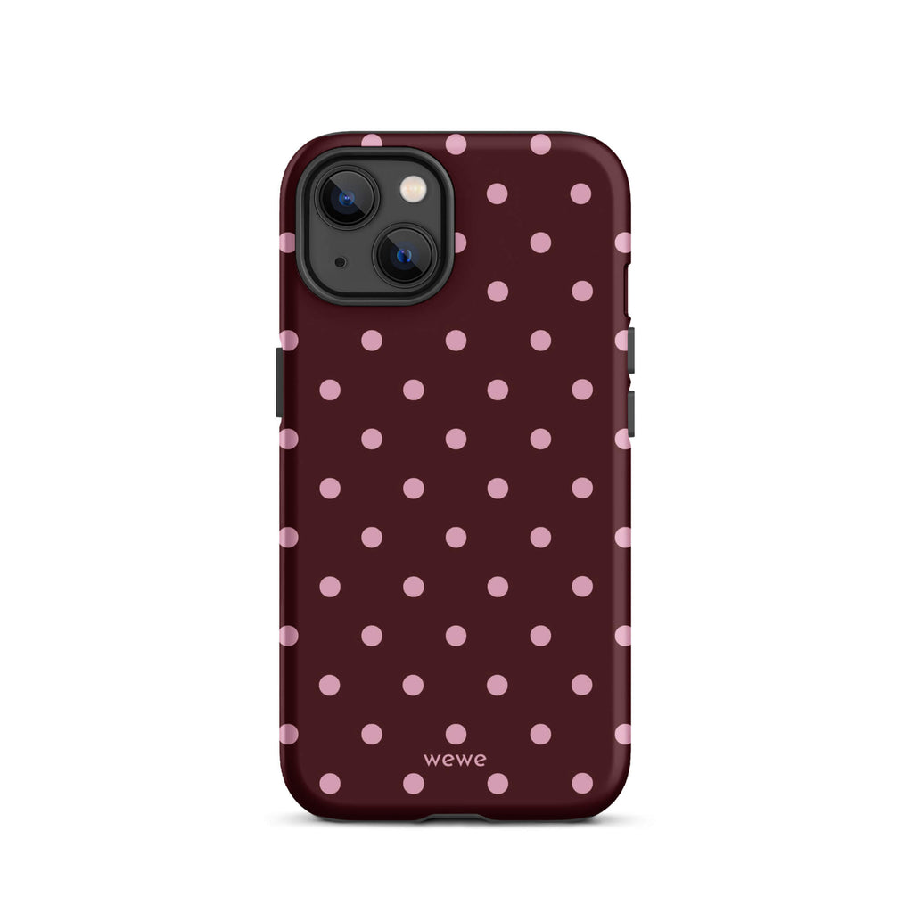 Deep burgundy iPhone case with evenly spaced soft-pink polka dots