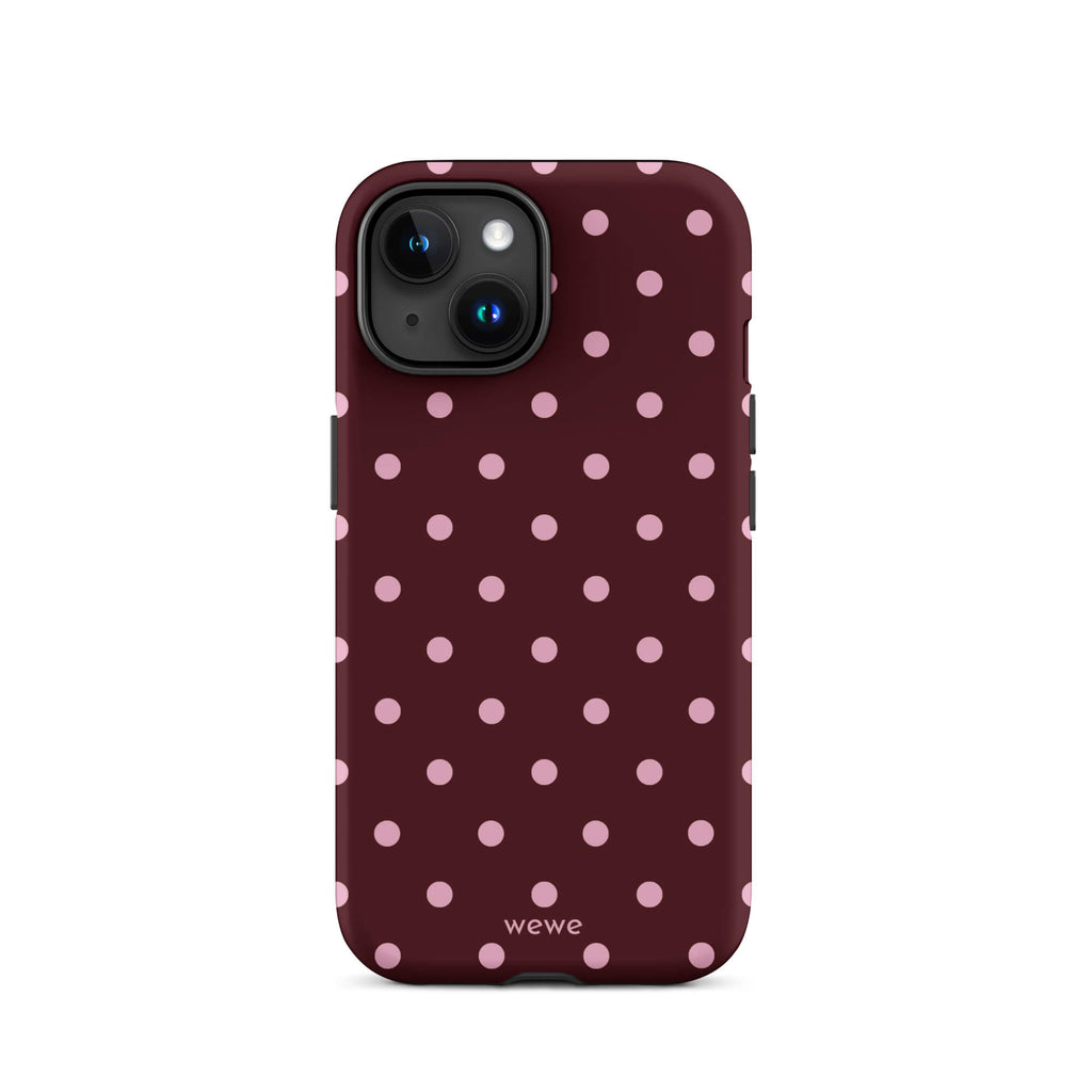Deep burgundy iPhone case with evenly spaced soft-pink polka dots