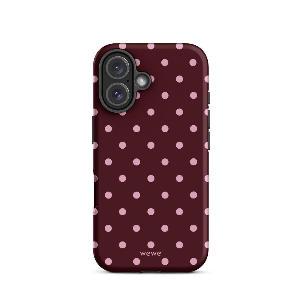 Deep burgundy iPhone case with evenly spaced soft-pink polka dots