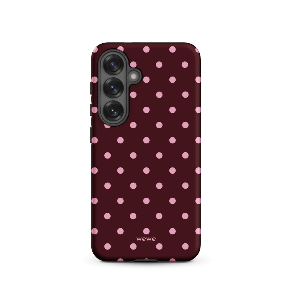 Deep burgundy iPhone case with evenly spaced soft-pink polka dots