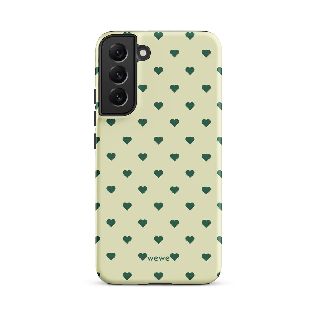 Pale buttercream iPhone case with evenly spaced forest-green mini hearts