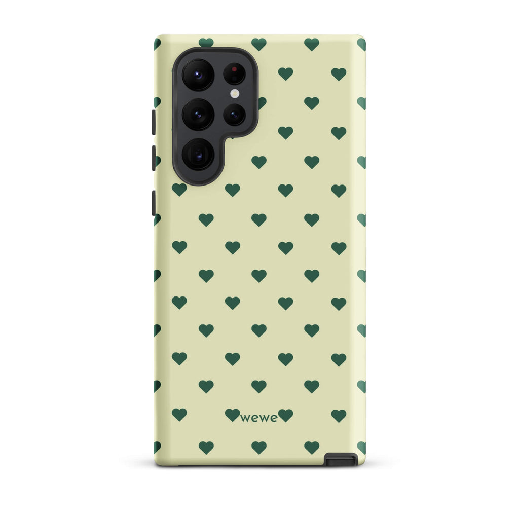 Pale buttercream iPhone case with evenly spaced forest-green mini hearts