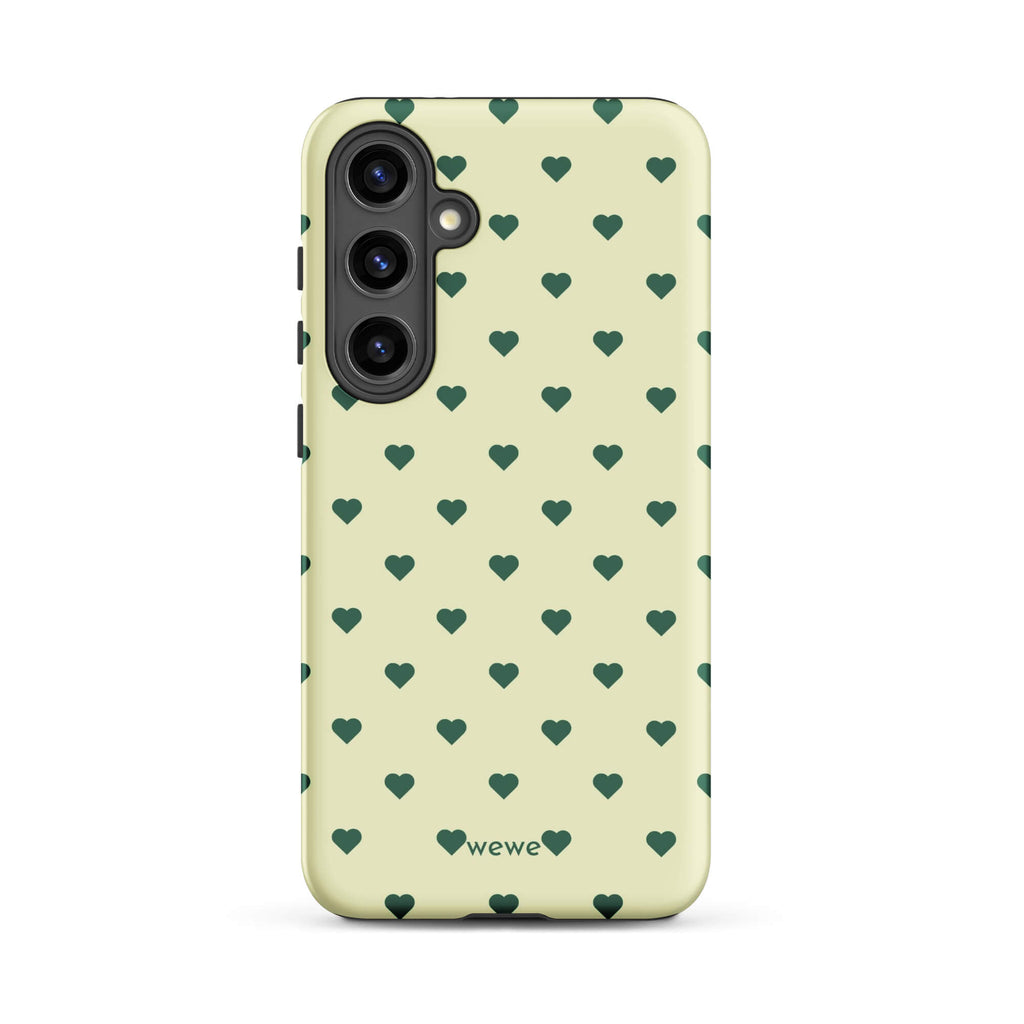 Pale buttercream iPhone case with evenly spaced forest-green mini hearts