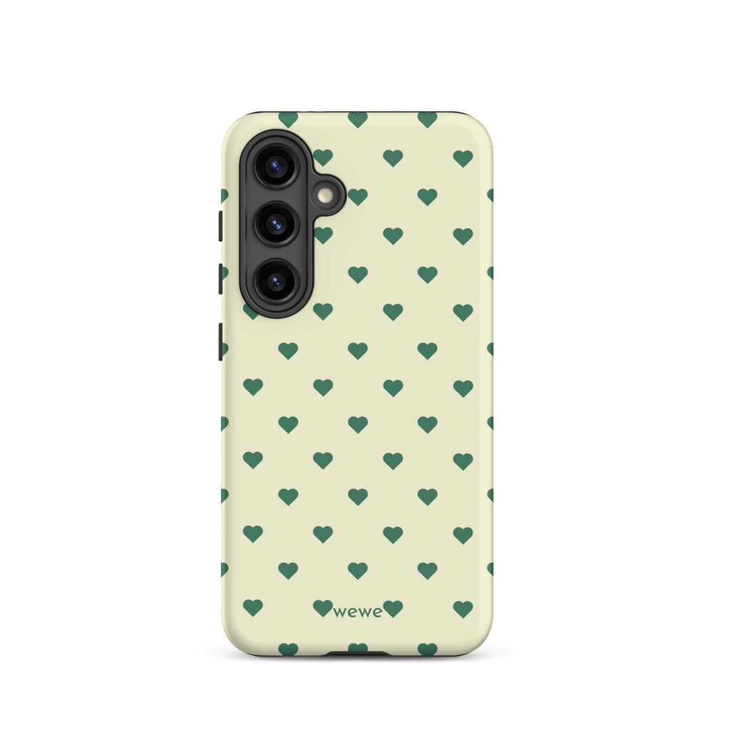 Pale buttercream iPhone case with evenly spaced forest-green mini hearts
