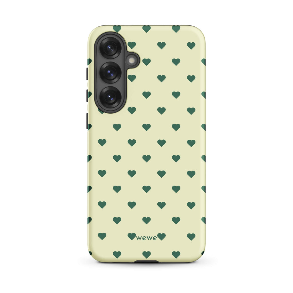 Pale buttercream iPhone case with evenly spaced forest-green mini hearts