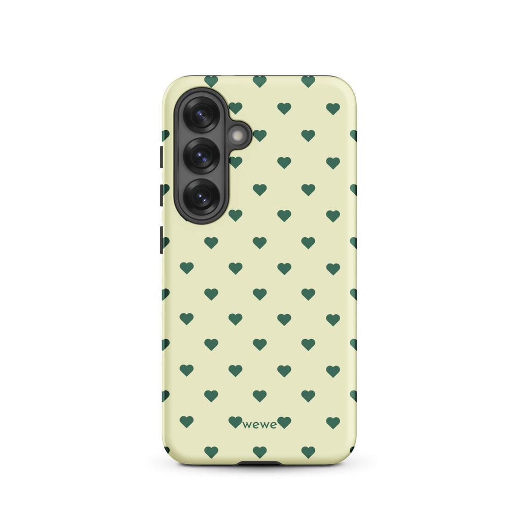 Pale buttercream iPhone case with evenly spaced forest-green mini hearts