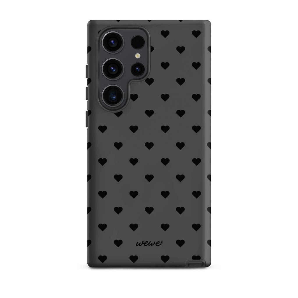Charcoal-gray iPhone case with evenly spaced black mini hearts