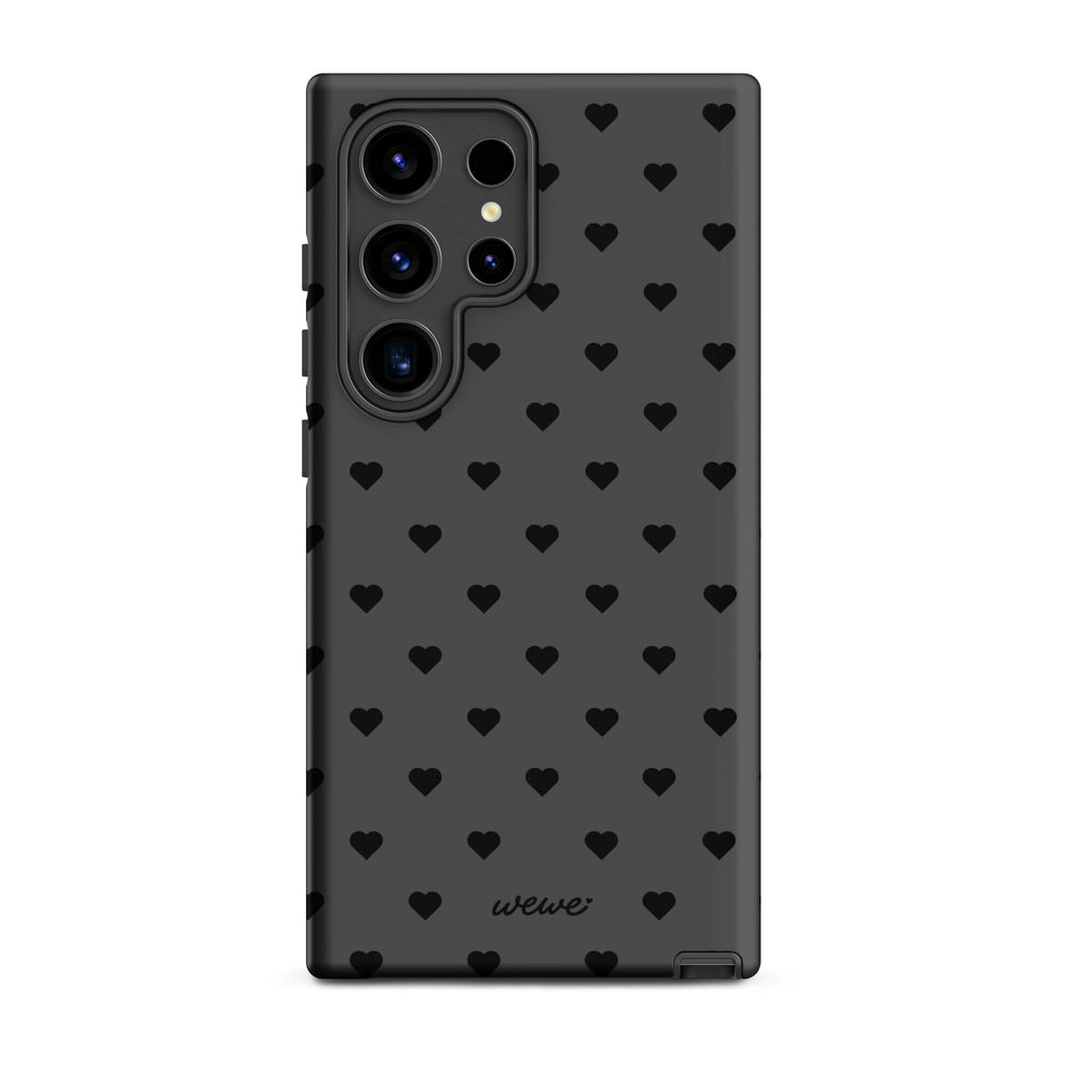 Charcoal-gray iPhone case with evenly spaced black mini hearts