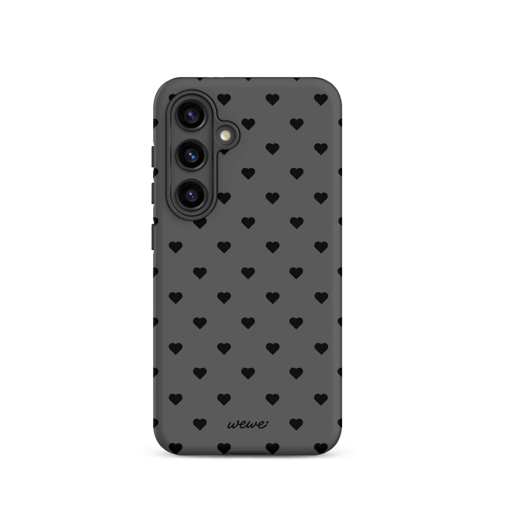 Charcoal-gray iPhone case with evenly spaced black mini hearts