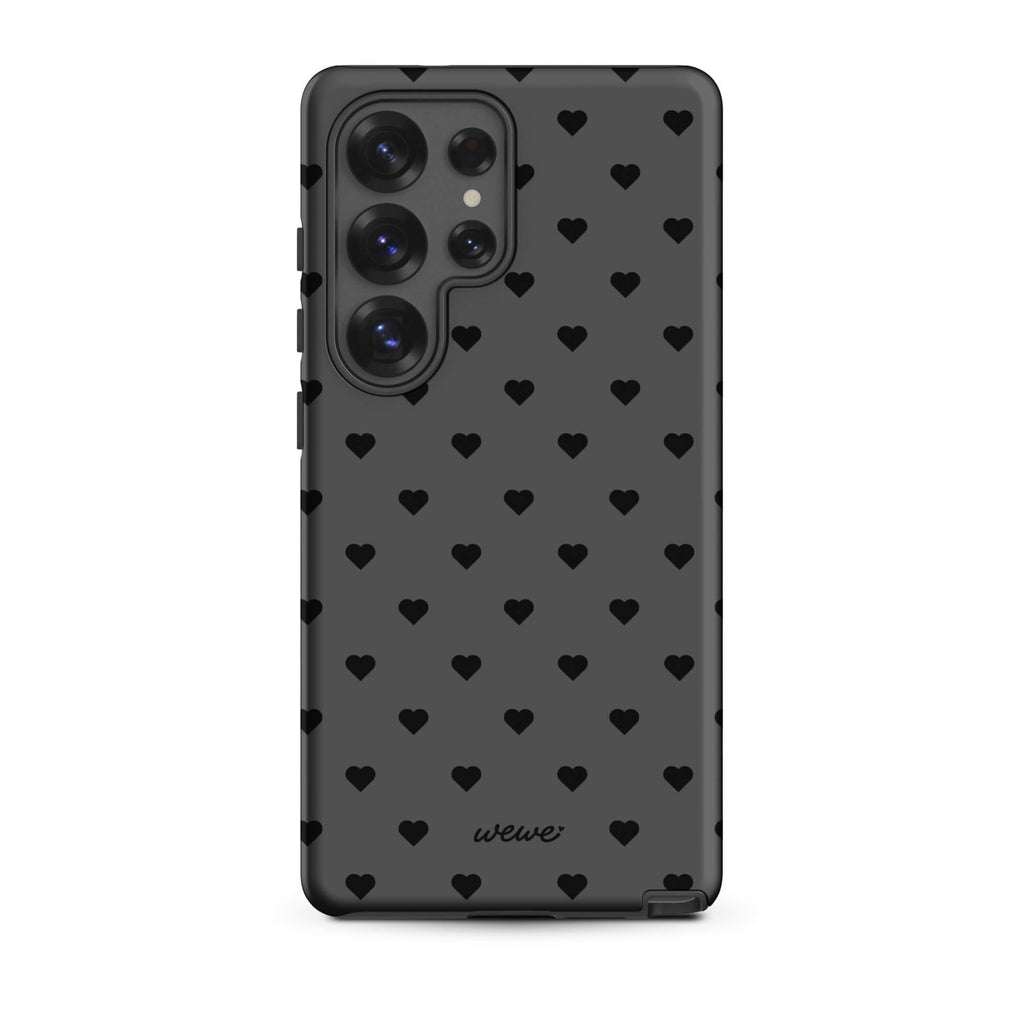 Charcoal-gray iPhone case with evenly spaced black mini hearts