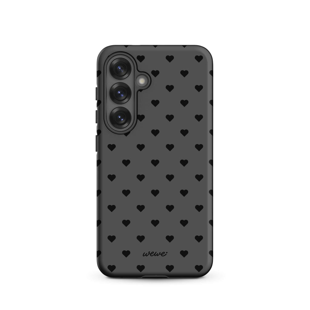 Charcoal-gray iPhone case with evenly spaced black mini hearts