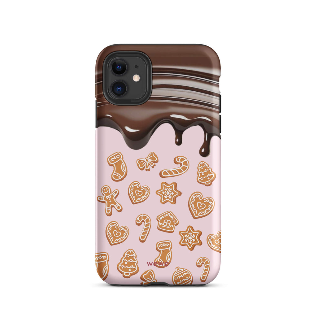 Custom iPhone 11 tough case featuring a top section resembling a melted chocolate bar dripping down onto a light pink background that is covered in a festive pattern of classic gingerbread cookies (gingerbread men, hearts, stars, candy canes, and trees), with 'wewe' branding at the bottom.