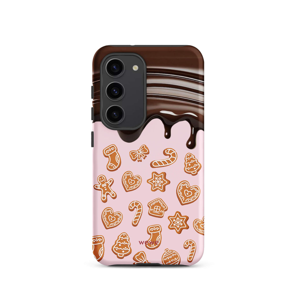 Custom samsung galaxy s23 tough case featuring a top section resembling a melted chocolate bar dripping down onto a light pink background that is covered in a festive pattern of classic gingerbread cookies (gingerbread men, hearts, stars, candy canes, and trees), with 'wewe' branding at the bottom.