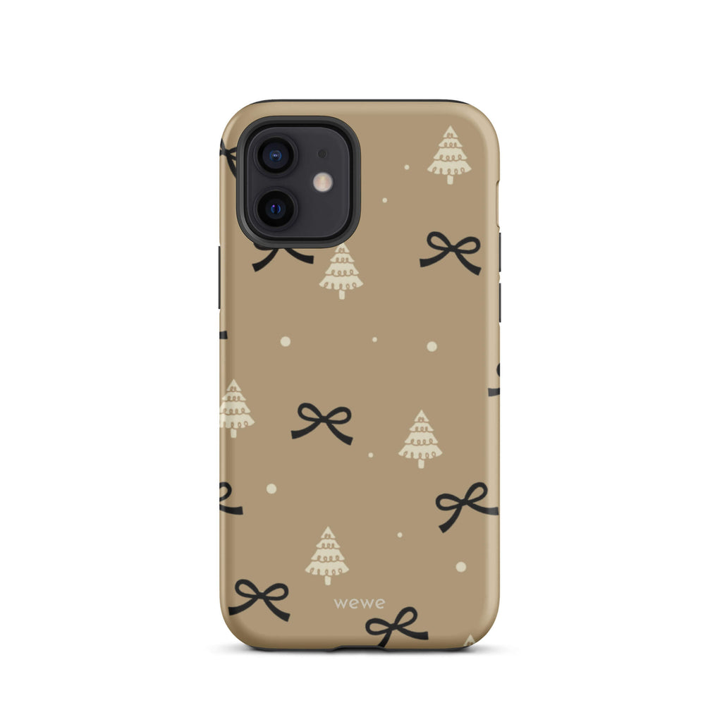 Custom iPhone 12 tough case in matte taupe/khaki brown featuring a scattered holiday pattern of small black bows, white doodle Christmas trees, and white snowflakes/dots, with 'wewe' branding at the bottom.