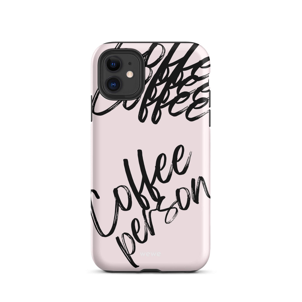 Custom iPhone case 11 pro with a light pink background and black brush script text that says 'Coffee Person'.
