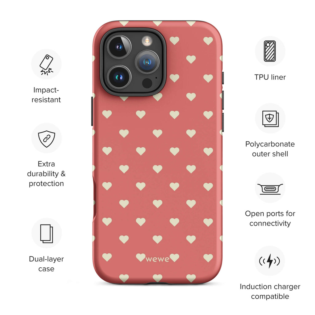 Coral-pink iPhone case with evenly spaced soft-cream mini hearts