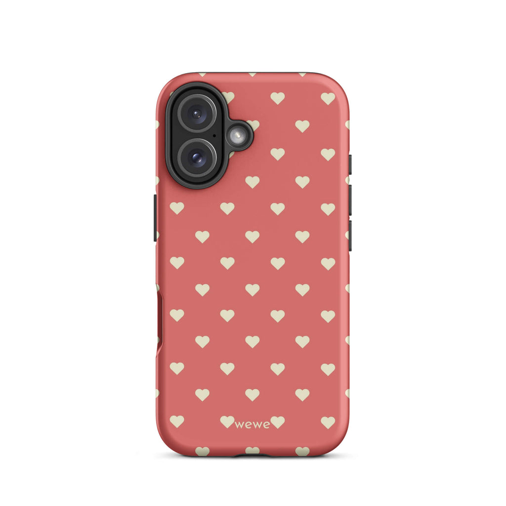 Coral-pink iPhone case with evenly spaced soft-cream mini hearts