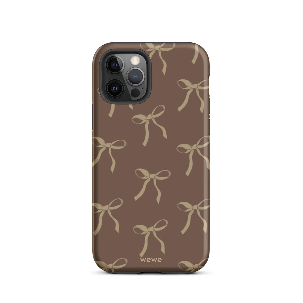 Custom iPhone 12 pro tough case in matte dark espresso brown featuring an all-over repeating pattern of light taupe/tan ribbons/bows, with 'wewe' branding at the bottom.