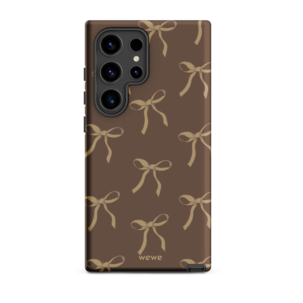 Custom samsung galaxy s24 ultra tough case in matte dark espresso brown featuring an all-over repeating pattern of light taupe/tan ribbons/bows, with 'wewe' branding at the bottom.