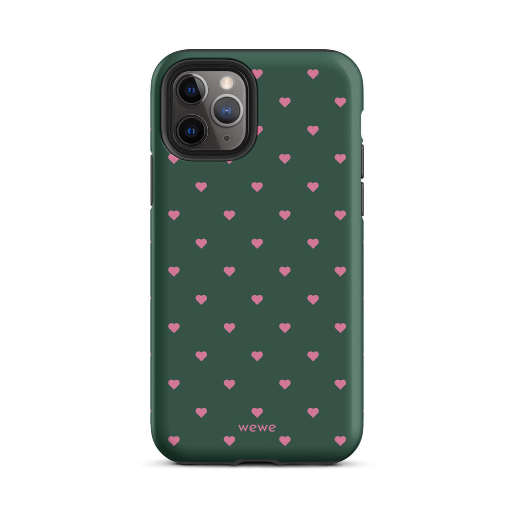 Deep forest-green iPhone case with evenly spaced vivid-pink mini hearts