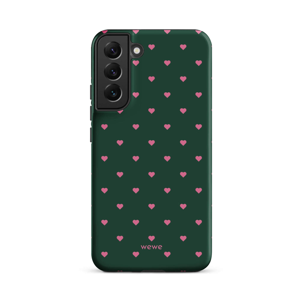 Deep forest-green iPhone case with evenly spaced vivid-pink mini hearts