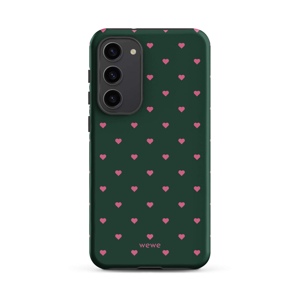 Deep forest-green iPhone case with evenly spaced vivid-pink mini hearts