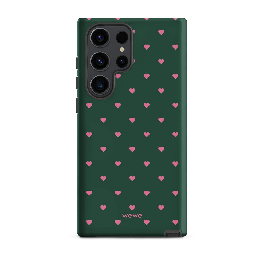 Deep forest-green iPhone case with evenly spaced vivid-pink mini hearts