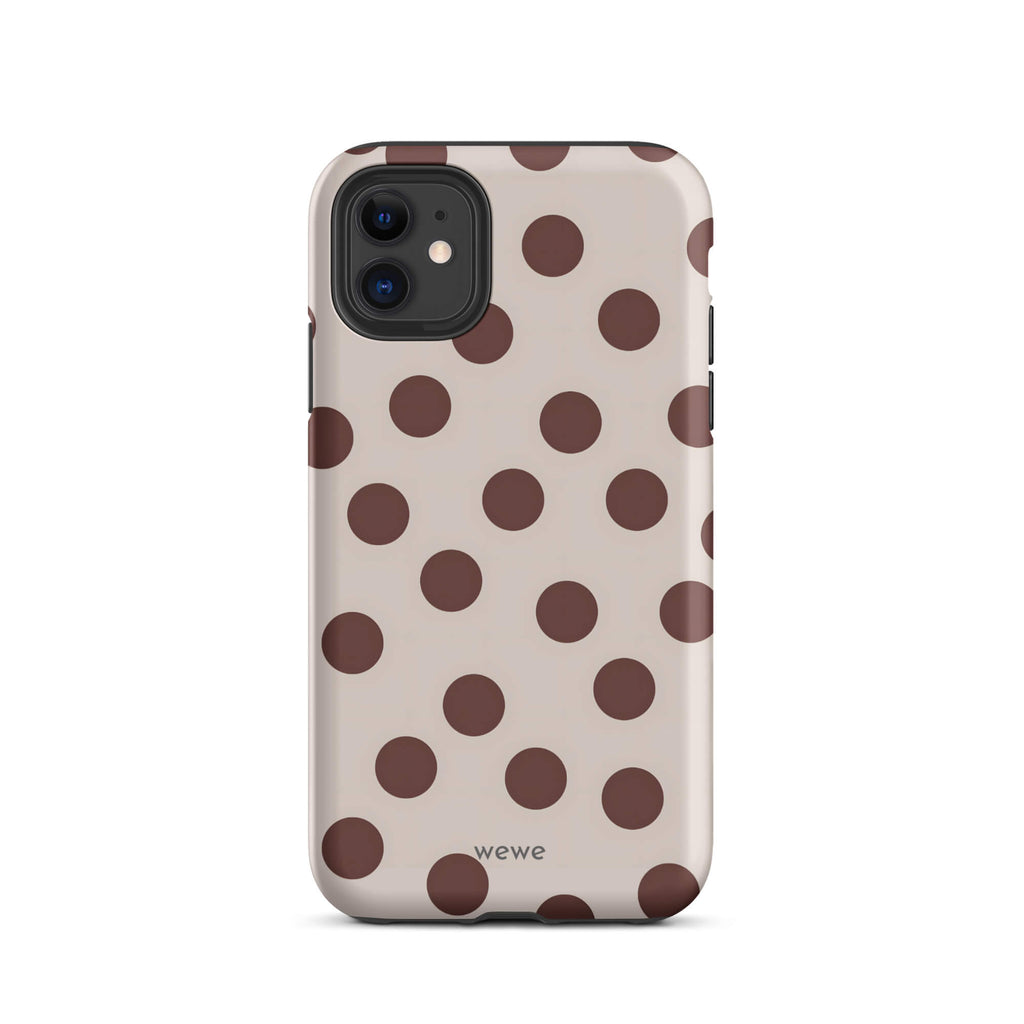 Custom iPhone 11 tough case in matte light beige/taupe with large dark brown (mocha) polka dots and 'wewe' branding at the bottom.
