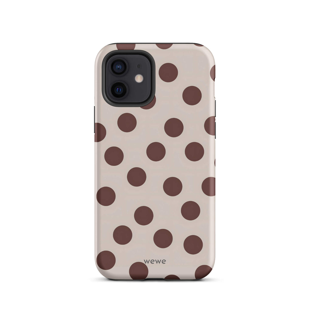 Custom iPhone 12 tough case in matte light beige/taupe with large dark brown (mocha) polka dots and 'wewe' branding at the bottom.