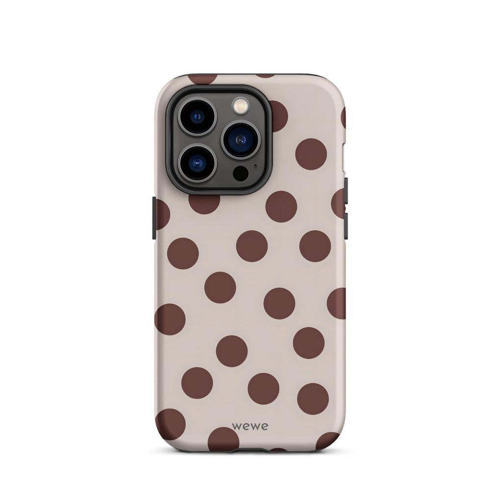 Custom iPhone 14 pro tough case in matte light beige/taupe with large dark brown (mocha) polka dots and 'wewe' branding at the bottom.