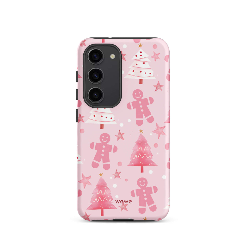 Custom samsung galaxy s23 tough case featuring a soft pastel pink background with a scattered pattern of pink gingerbread men, pink and white Christmas trees, and watercolor pink stars, with 'wewe' branding at the bottom.