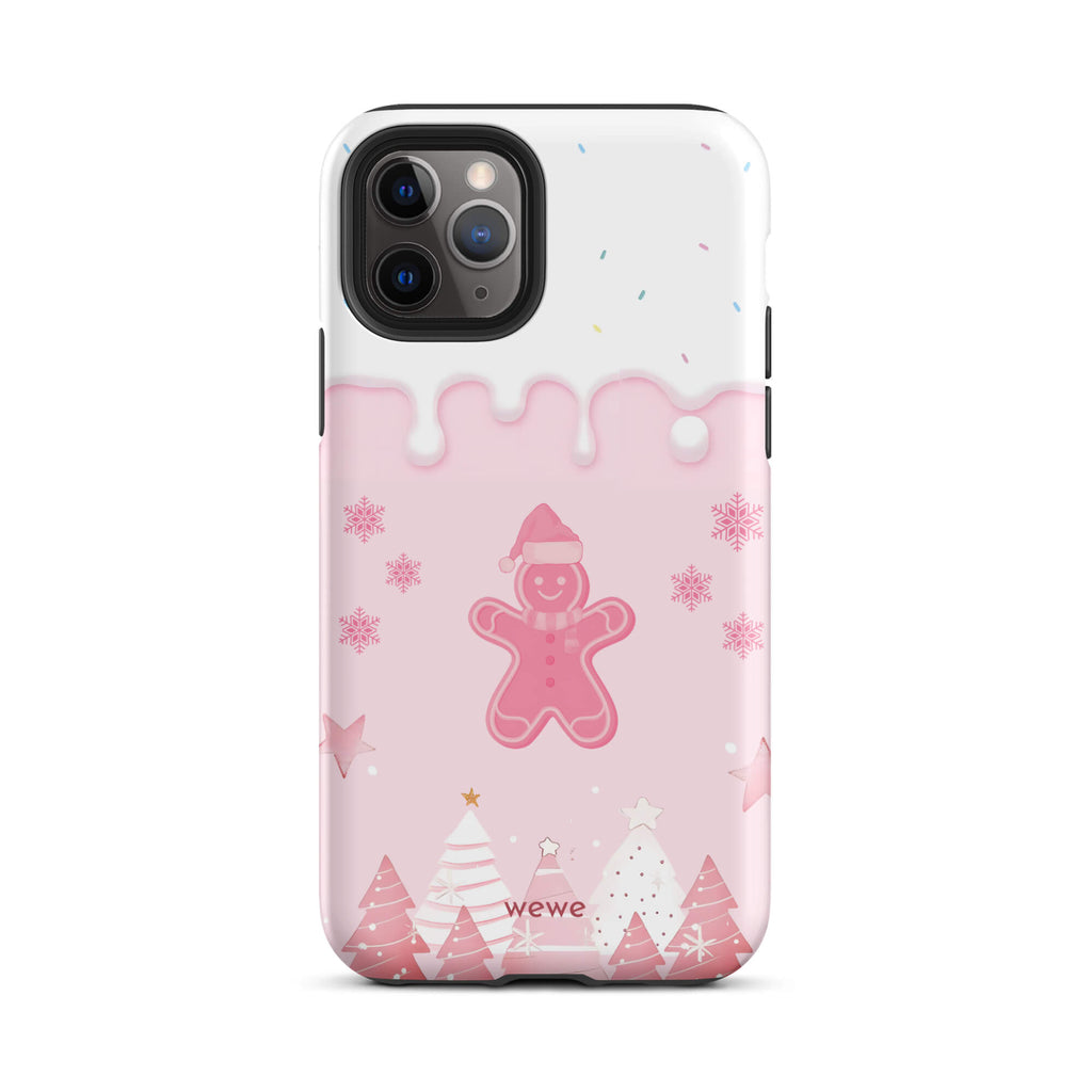 Custom iPhone 11 pro tough case featuring a white top panel with colorful sprinkles and a pink icing drip border, showcasing a cute gingerbread man wearing a Santa hat, surrounded by pink snowflakes and stylized pink/white Christmas trees, with 'wewe' branding at the bottom.