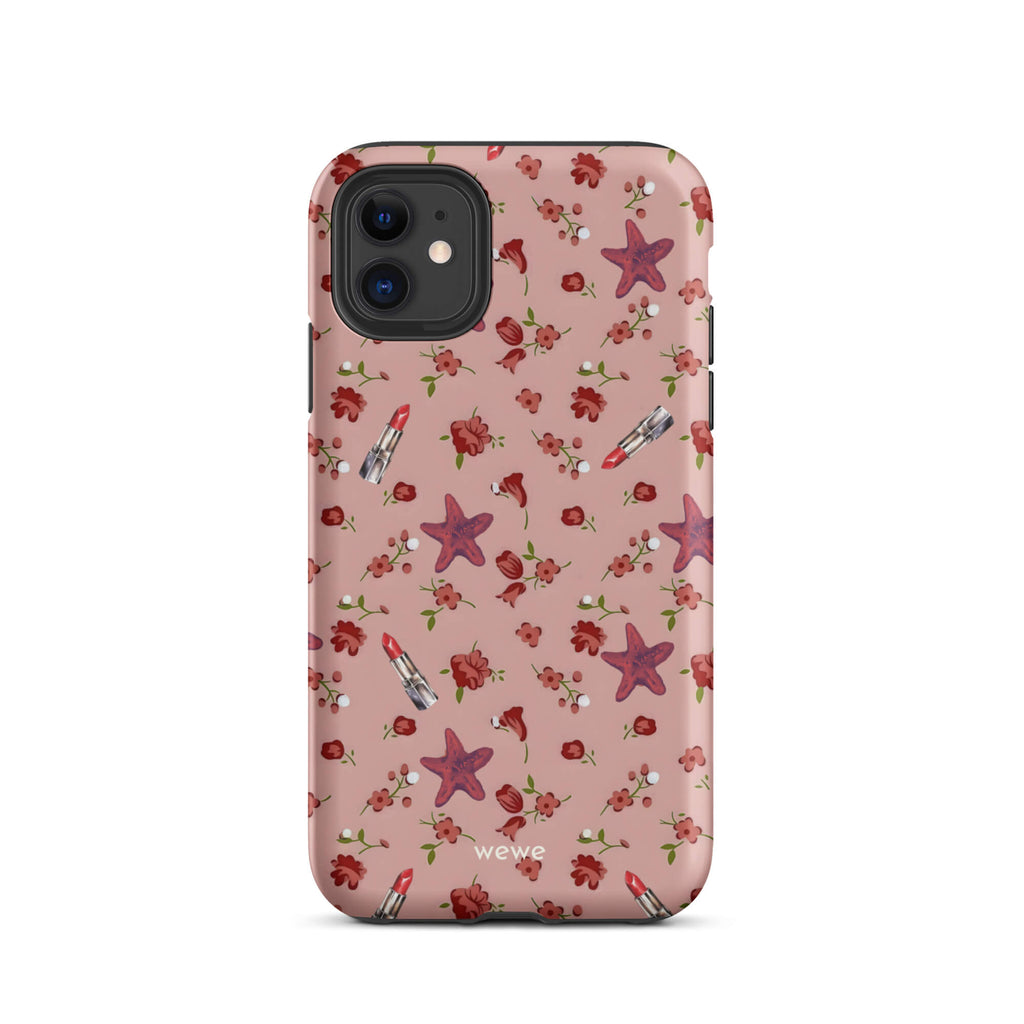 Custom iPhone case 11 with a  retro pattern of red flowers, starfish, and lipstick tubes on a pink rose colour background.