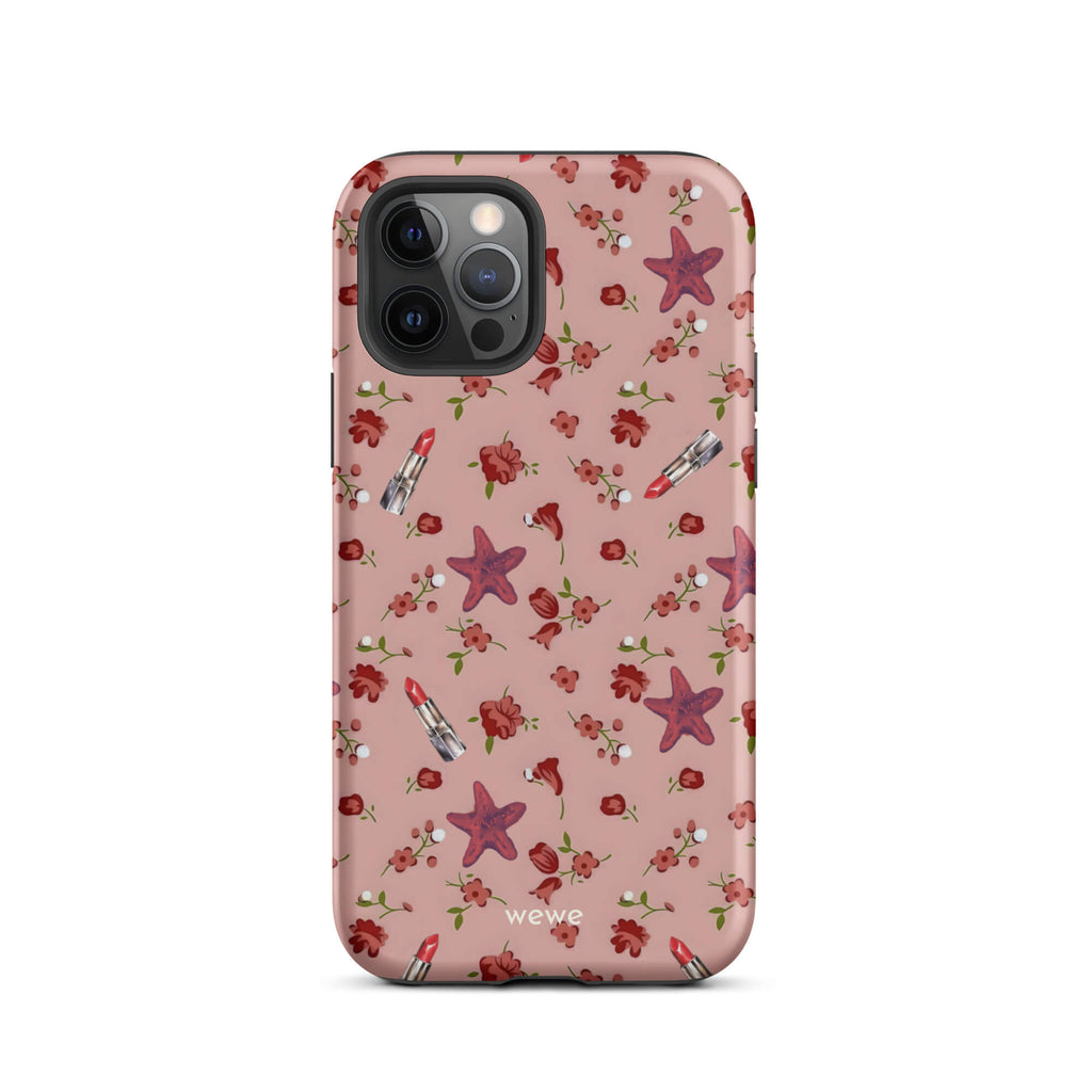 Custom iPhone case 12 pro with a  retro pattern of red flowers, starfish, and lipstick tubes on a pink rose colour background.