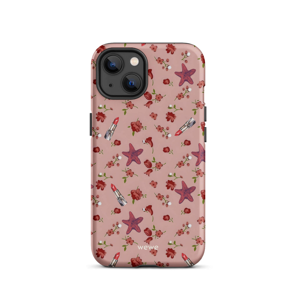 Custom iPhone case 13 with a  retro pattern of red flowers, starfish, and lipstick tubes on a pink rose colour background.