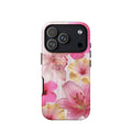 A cute pink floral phone case featuring watercolor hibiscus, orchid and tropical flowers over soft pink stripes iPhone 17 pro max case.