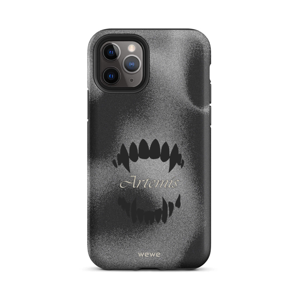 Custom iPhone case 11 pro with a black, textured gritty background, a vampire teeth graphic, and the word "Artemis".