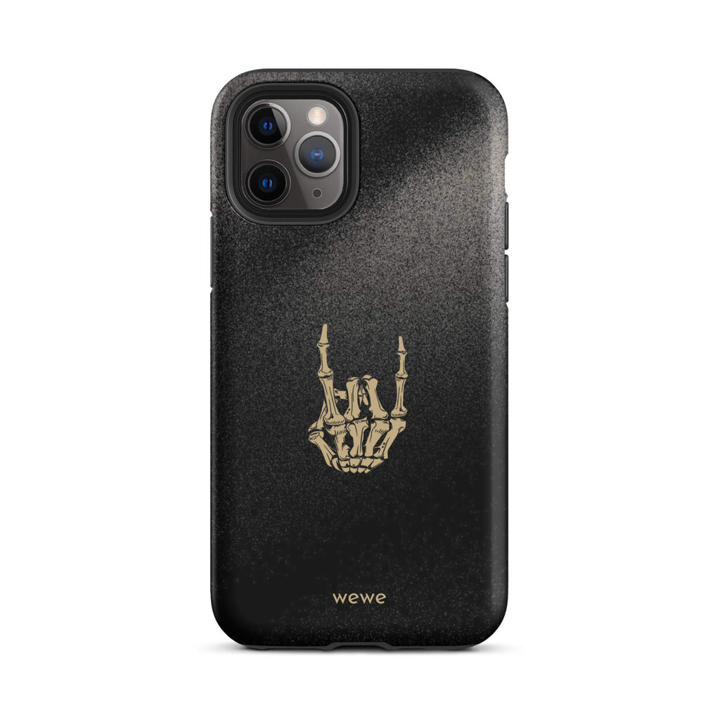 Custom iPhone case 11 pro with a black, gritty background and a gold skeleton hand making the "rock on" gesture.