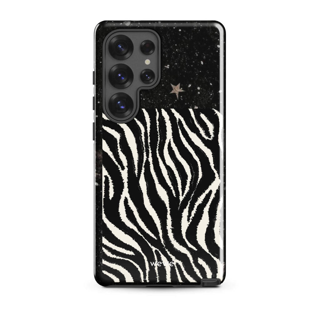 Custom samsung galaxy s25 ultra with a black, glittery cosmic/galaxy top half with stars, and a bold black and white zebra stripe pattern on the bottom half.
